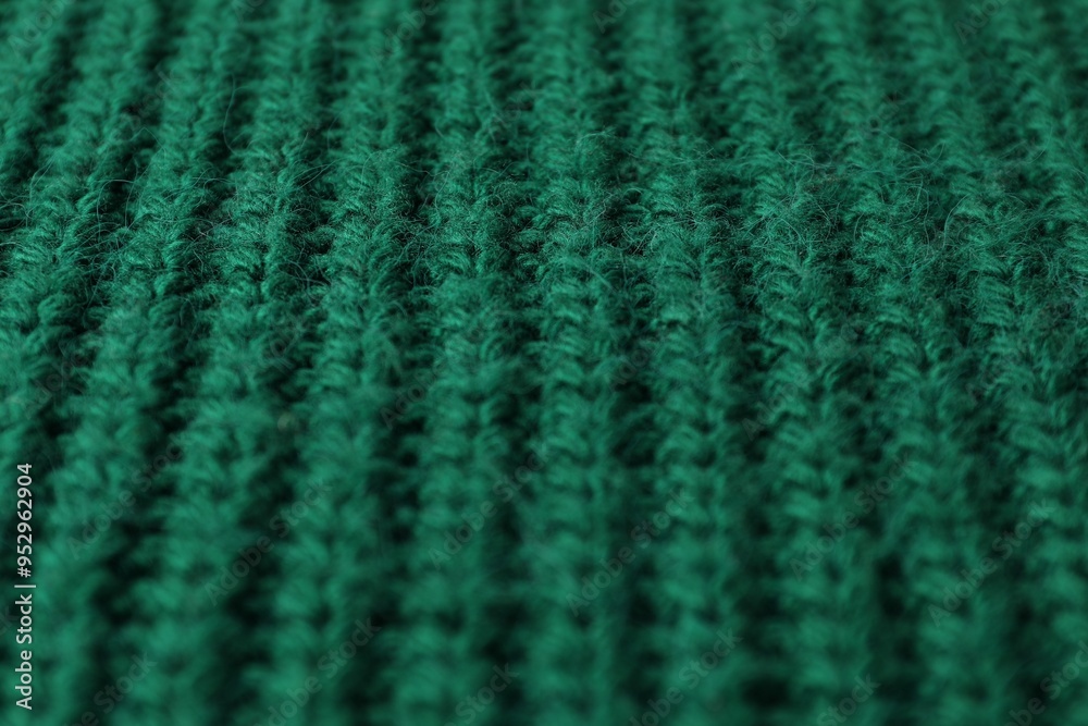 Poster Texture of green knitted fabric as background, closeup