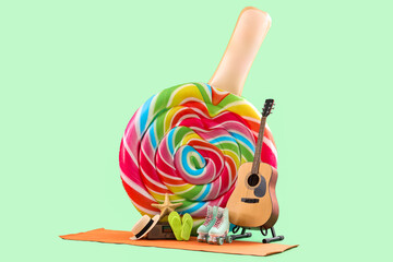 Inflatable mattress in shape of candy,  guitar, skates and beach accessories on green background....