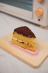 chocolate topping cake on wood board