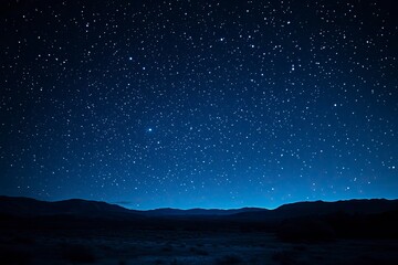 Fototapeta premium A stunning natural spectacle, often seen in remote areas with minimal light pollution, where countless stars create a breathtaking celestial display against the deep blue night sky, ai