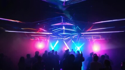 Energetic crowd enjoying a vibrant nightclub atmosphere, surrounded by colorful lights and dynamic laser displays creating an electrifying experience