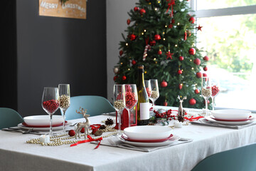 Dining table set for Christmas with beads in room