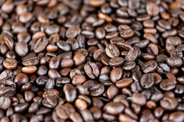 Roasted coffee beans, black coffee background