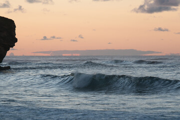 Waves Crash on a Beach in Poipu Kauai Hawaii at Sunrise