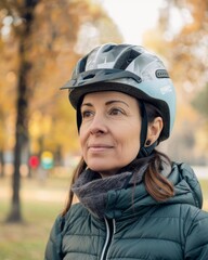 Mid age woman wearing skateboard or bike helmet portrait