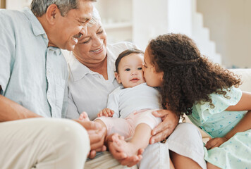 Happy, care and grandparents with baby and child in home for bonding, connection or family time. Smile, love and senior man and woman holding infant with girl kid sibling in living room at house.
