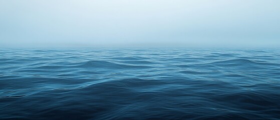 Dark Blue Ocean with Ripples and Distant Fog