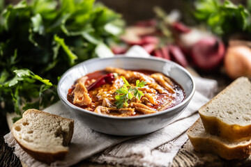 Tasty soup or stew made of beef tripe and spices. Spicy and aromatic tripe soup seasoned with pepper and served with bread