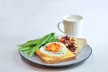bread with egg and cheese topping or  sunny side up egg , lettuce and almond with dried cranberry and milk