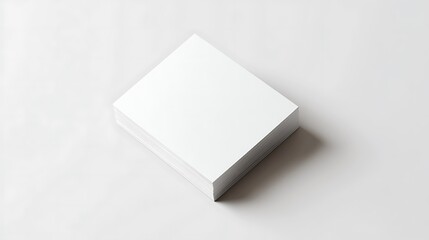 A Stack of White Papers on a White Surface