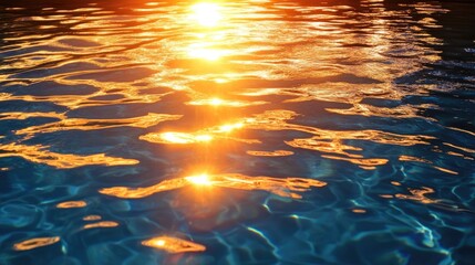 Sunset reflections on a calm swimming pool surface, creating a magical golden hour ambiance.