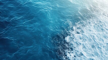Fototapeta premium Serene topdown view of calm ocean with deep blue water, perfect for relaxation.