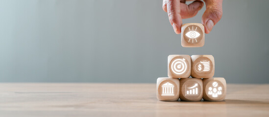 Wooden blocks illustrating the balanced scorecard concept, showcasing business strategy,...