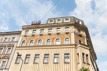 Decorative patterns on facade of old building on Sennaya Square Street in old part of Prague in Czech Republic