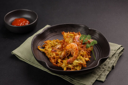 Vietnamese Shrimp and Sweet Potato Fritters or Banh Tom Chien Khoai Lang.