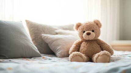 A soft, plush teddy bear sitting on a child bed, surrounded by pillows. Ample space for text on the bedspread.