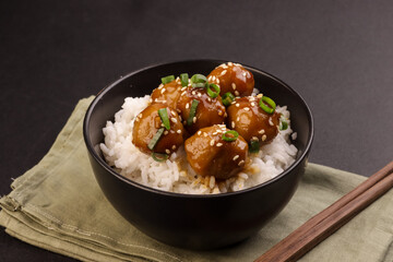 Meatballs Teriyaki with Sesame Seeds in a Bowl, Served with Rice.