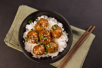 Meatballs Teriyaki with Sesame Seeds in a Bowl, Served with Rice.