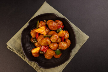 Sweet and Sour Meatballs with Pineapple and Vegetables.