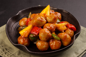 Sweet and Sour Meatballs with Pineapple and Vegetables.