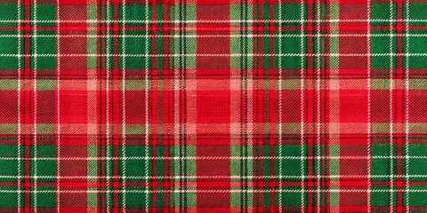 Vibrant red and green plaid fabric drapes elegantly, perfect for holiday decorations and winter themed designs