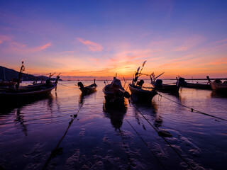 sunset at the beach with boat