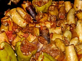 bell peppers stuffed Egyptian mahshi and Eggplants white and black aubergine Mahshy filled with white rice, onion, parsley, dill and coriander, Arabic Egyptian traditional cuisine of Mahshy