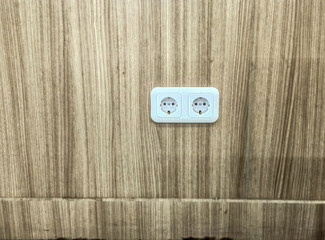 electrical socket isolated marble wall background