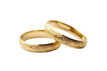A close-up of classic gold wedding rings isolate on white background