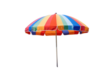 A colorful beach umbrella with vibrant stripes set up on a sandy beach with a clear blue sky in the background