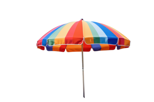 A colorful beach umbrella with vibrant stripes set up on a sandy beach with a clear blue sky in the background