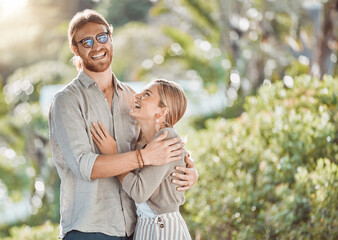 Couple, hug and laughing with love in garden with care, bonding and outdoor in spring for connection. People, man and woman in embrace, funny joke or smile in backyard for memory by trees in Croatia