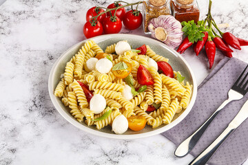 Italian pasta with mozzarella and tomato
