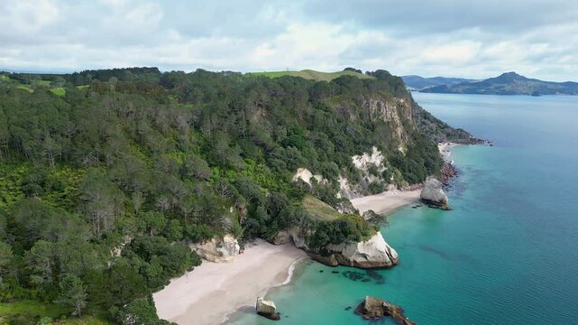 Coromandel, New Zealand: Aerial drone footage of the dramatic coast of the Coromandel pensinsula with the stingray and cathedral coves in New Zealand north island. 