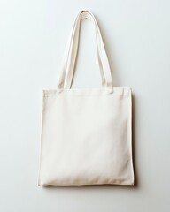 Blank white canvas tote bag isolated on white background.