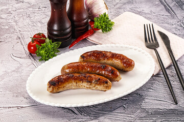 Delicous natural roasted sausages in the plate
