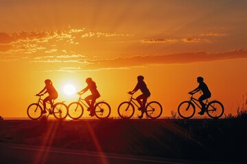 Naklejka premium Group of people cycling together at sunset with warm light and shadows