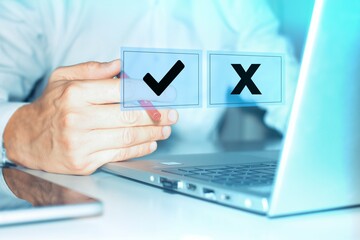 Businessman is thinking and making choices between right and wrong symbols. Decide to vote concept. Yes or No decisions, business options in difficult situations. True False, crisis decision making.