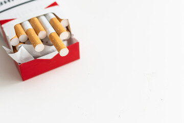 Open blue pack of cigarettes isolated on white background. Box of cigarettes closeup.