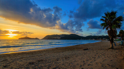 Sunset over the beach of Agios Georgios on the island of Corfu