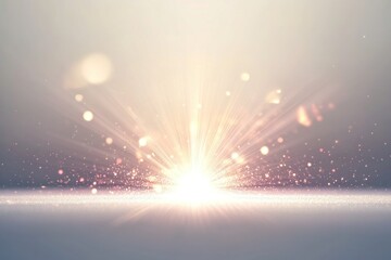 Abstract light burst with sparkling particles on a soft gradient background.