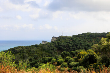  View over wooded mountains and olive plantations to Cape Drastis in the north of the island of Corfu