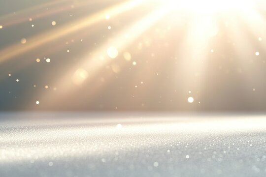 A soft, white surface illuminated by warm, golden light with a soft glow and subtle sparkles.