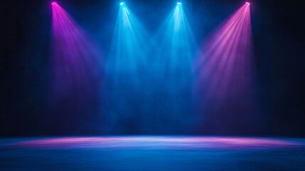 Vibrant stage lights in blue and pink hues create an electrifying atmosphere for a performance.