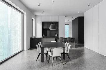 Elegant home kitchen interior with dining table and chairs, cabinet and window