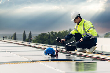 Inspector examination of photovoltaic modules using a thermal imaging camera. Engineer Checking...