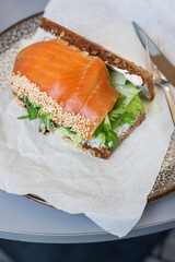 Toast with salmon and vegetables for breakfast.