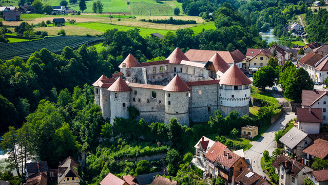 Zuzemberk Castle and medieval village on the river Krka in Slovenia. Aerial drone view