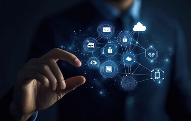 Fototapeta premium A businessman is touching a digital network of technology icons.