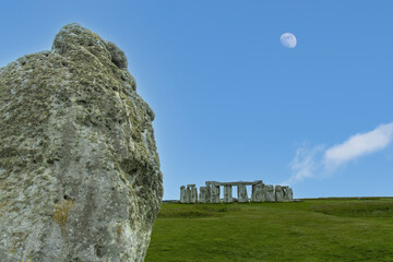 Close up of heel stone that indicatis location of solstice with in background Stonehenge...